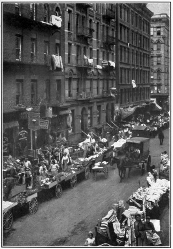 THE GHETTO OF THE NEW WORLD.

East of the Bowery in New York City is the heart of the largest Jewish
community in the world. Sidewalks, street signs, language, all indicate
the process of development.